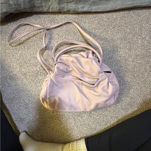 The softest and cutest bag ever. In like new condition. Had additional strap.